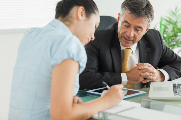 istock Business man and woman working at table 827721846