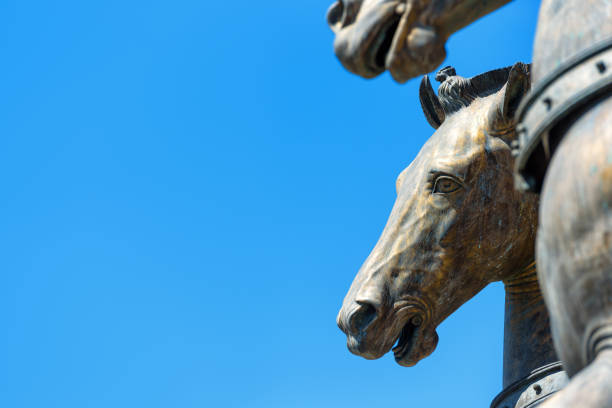 istock San Marco bronze horses on the blue sky background 827733264