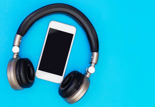 istock Blank Mobile phone screen inside of Golden headphone 827736096
