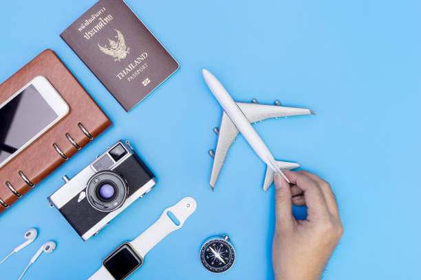 istock Hand holding toy plane for travel object concepts 827736106