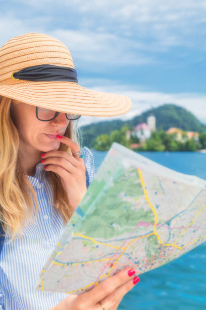 istock Tourist with a map enjoying the summertime. 827740238