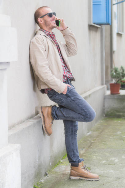 istock Urban guy talking on the phone outdoors. 827742814