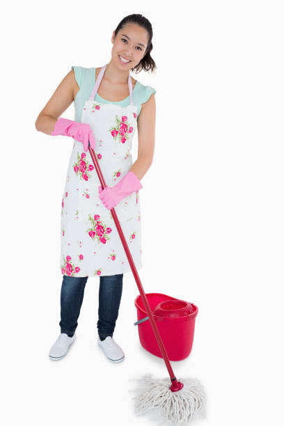 istock Smiling woman cleaning the floor 827751962