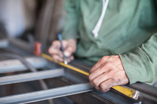 istock Worker measuring steel with measuring tape 827757602