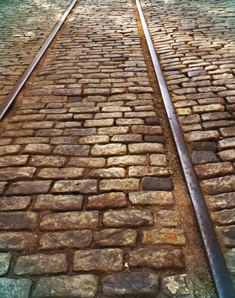 istock Brick Road and Trolley Tracks in Historic Savannah Georgia Riverfront District 827758250