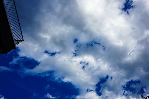 cloudy sky nicely blue with balcony fence