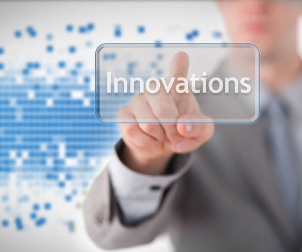 istock Businessman standing while pointing to the word innovation 827776356