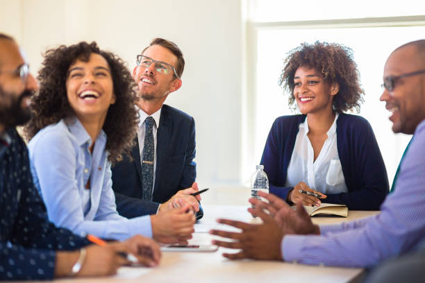 istock Cheerful Office Workers Enjoying Meeting 827780454