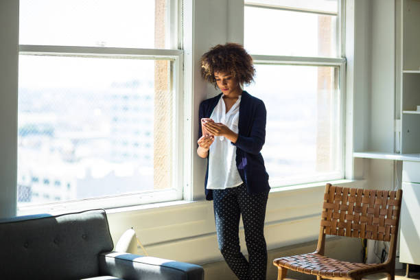 istock Woman Looking at Cell Phone 827780820