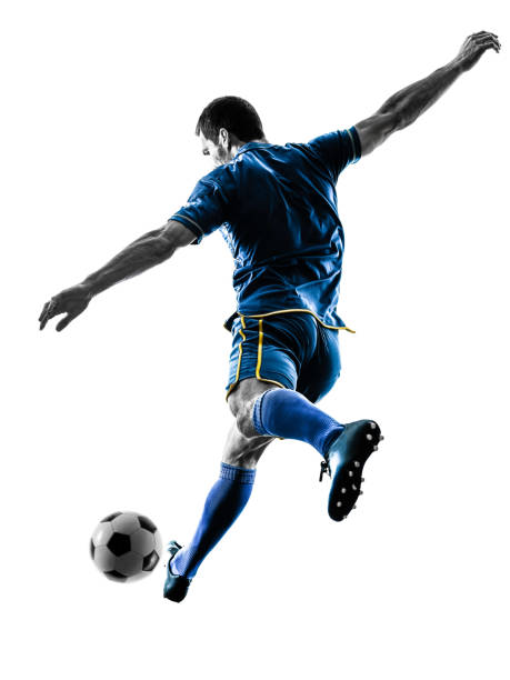 分離されたシルエットを蹴るサッカー選手男 - サッカー選手 ストックフォトと画像