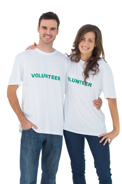 istock Two cheerful people wearing volunteer tshirt 827783474