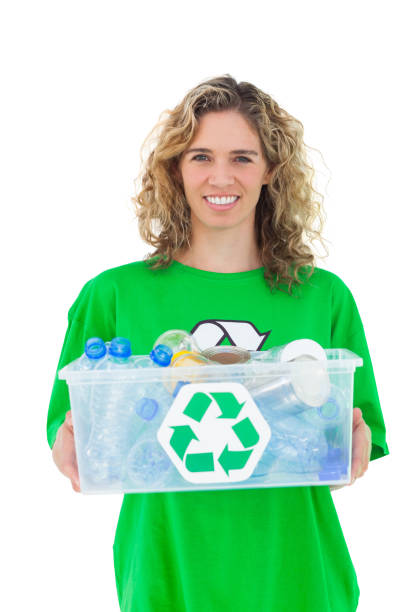 istock Smiling activist holding recycling box 827783532