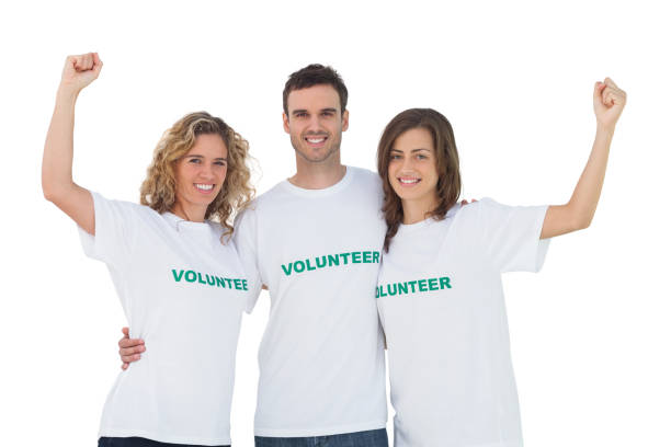 istock Smiling group of volunteers raising arms 827783574