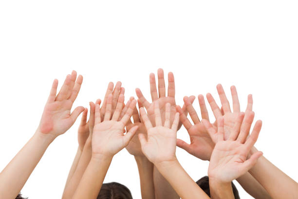 istock People raising hands in the air 827783802