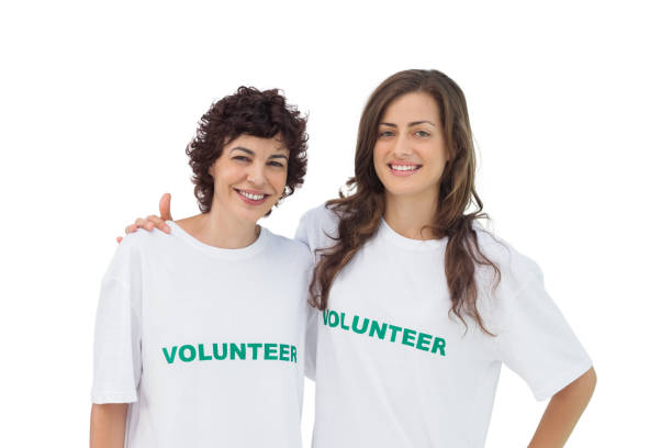 istock Two cheerful volunteers standing 827783830