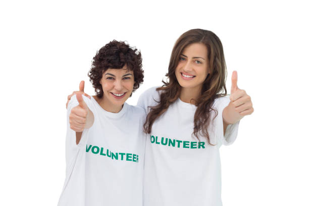 istock Two smiling volunteers giving thumbs up 827783840