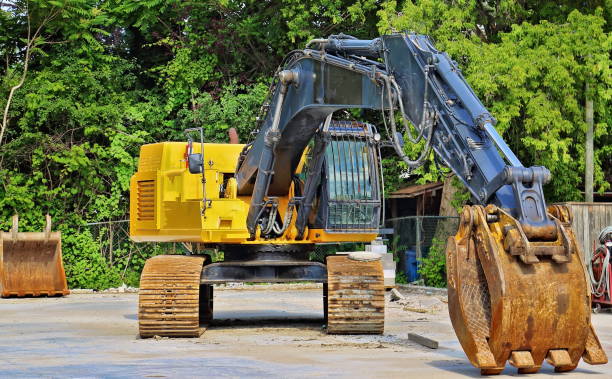istock Excavator after completion of demolition work 827788096
