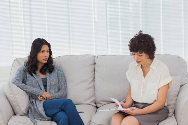 istock Patient speaking to her therapist 827793078