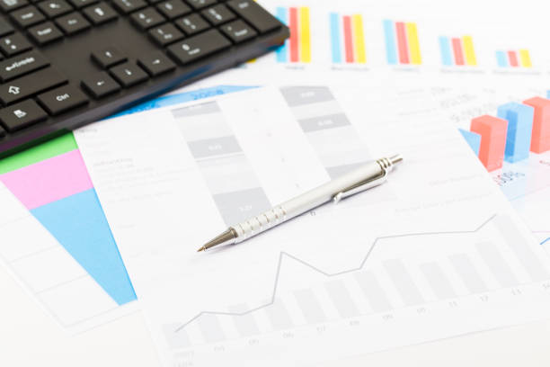istock Financial printed paper charts, graphs on desk 827795944