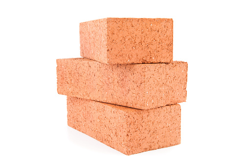 Building Products Materials in construction site,construction red hollow bricks Stack on road side