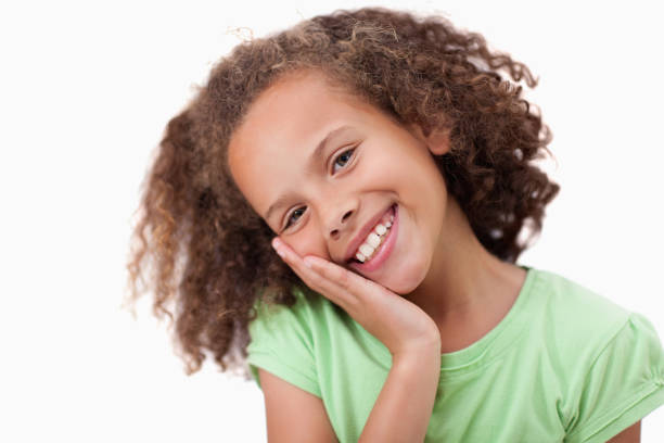 istock Cute girl with her hand on her cheek 827799282