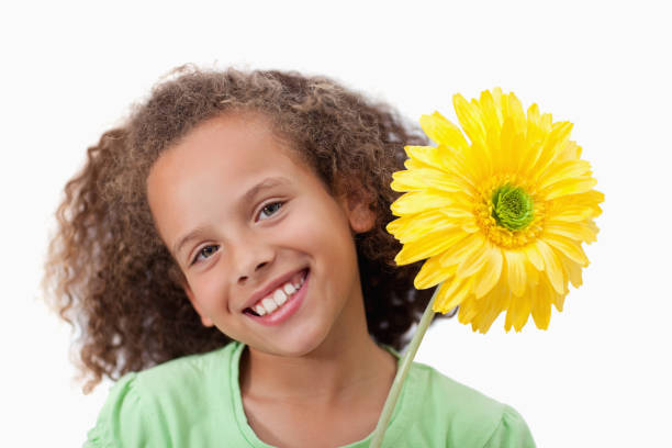 istock Cute girl holding a flower 827799402