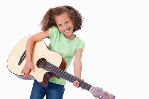 istock Happy girl playing the guitar 827799476