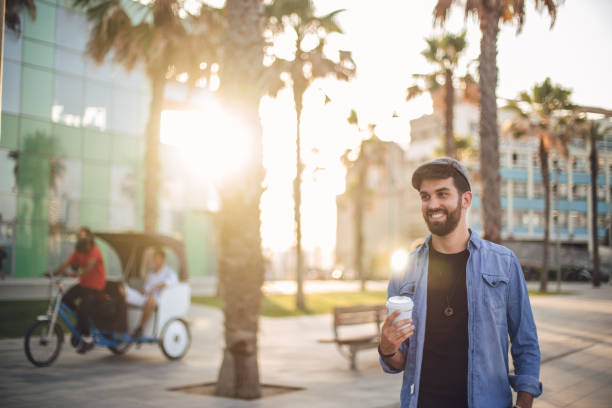 istock Young man walking in the city 827799982