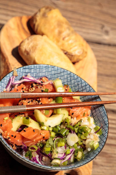 istock Raw salmon poke bowl with rice 827802250