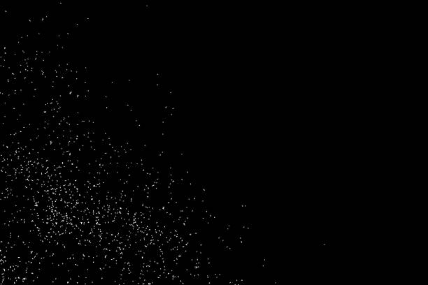 istock Abstract grainy texture isolated on black background. Silhouette of food flakes such as salt or almond or wheat flour spread on the flat surface or table. Top view. Dust, sand blow or bread crumbs. 827803682