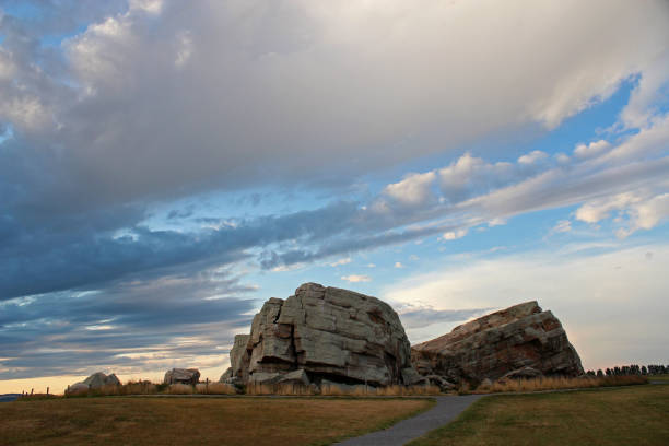Low sun accents the biggest rock in the Foothills Erratic Train, near Okotoks, south of Calgary, Alberta, Canada.