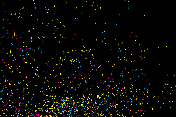 istock Colorful celebration background with confetti isolated on black, Abstract background with many splattered falling round glitter pieces. Sprinkle random pattern made of confetti blow drops. 827807058