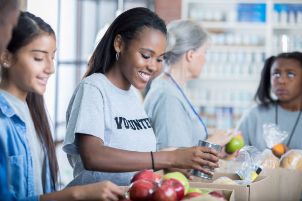 istock Diverse volunteers pack up food donations 827810198