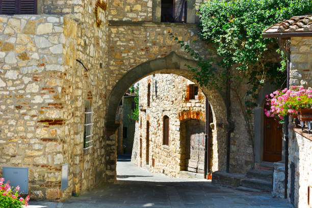 istock Street with Archway in Italy 827814378
