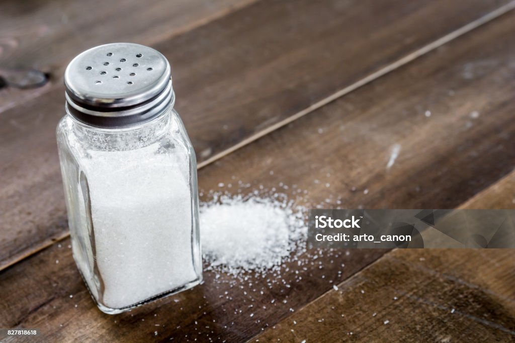 Salt in wooden table Salt - Seasoning Stock Photo