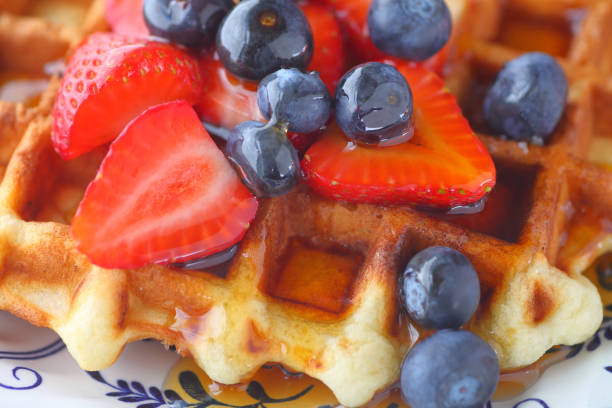 istock Blueberries and strawberries on waffle 827821486