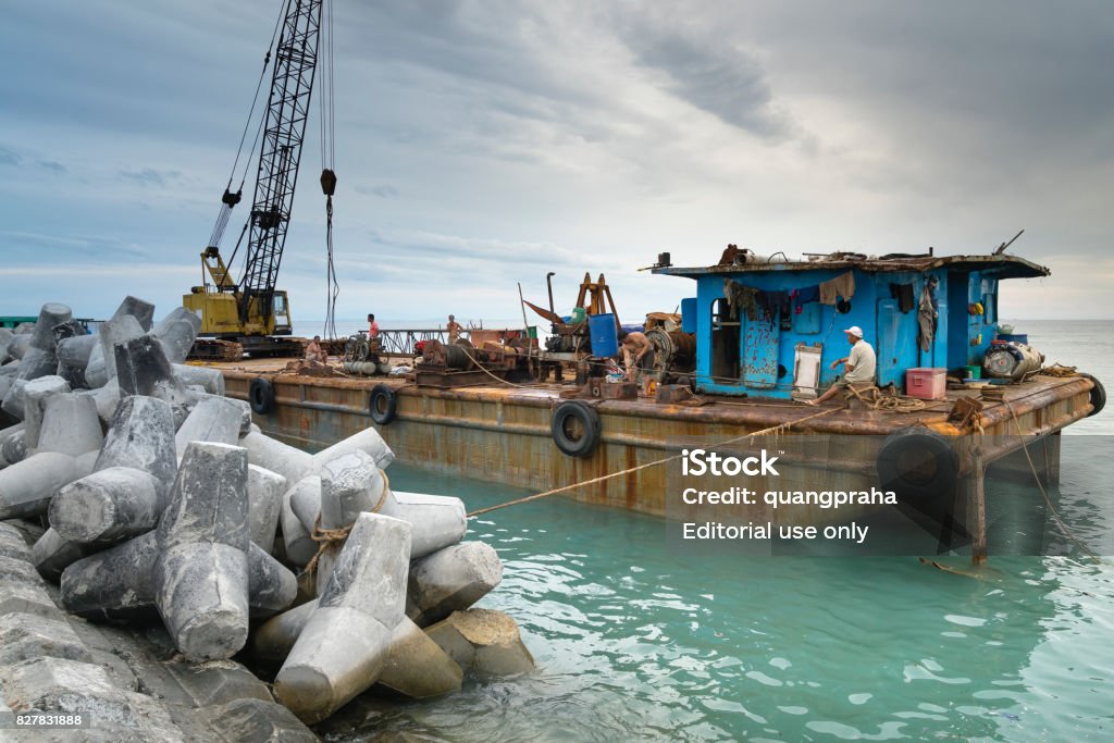 The port is under construction Ly Son Island, Quang Ngai Province, Vietnam - July 29, 2017: The port is under construction on Ly Son Island, Quang Ngai province, Vietnam. Ly Son Island is a very attractive tourist destination Adult Stock Photo