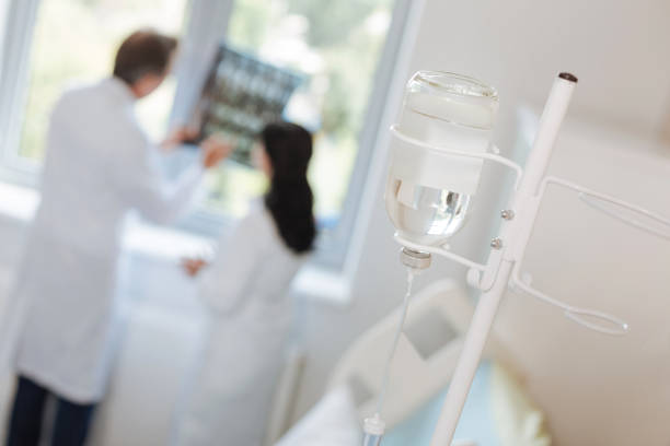 istock Selective focus of a bottle with medicine for IV 827832806