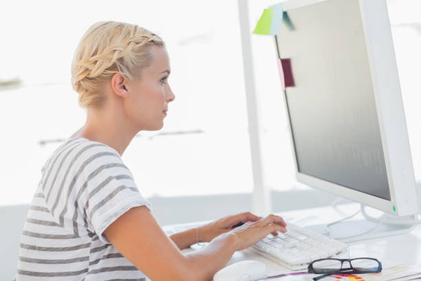 istock Pretty designer typing on her laptop 827837696