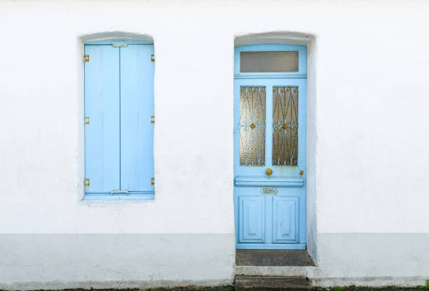 istock House facade with pastel blue blinds and door 827840020
