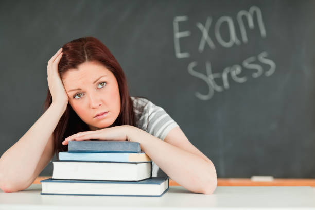istock Beautilful student stressed by her examinations 827843610