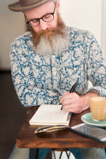 istock Senior Man Writing Working Coffee Shop Realxation Concept 827846614