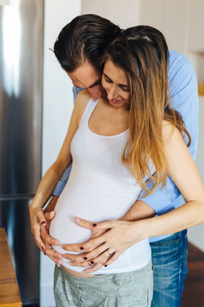istock Pregnancy, couple at home 827846824
