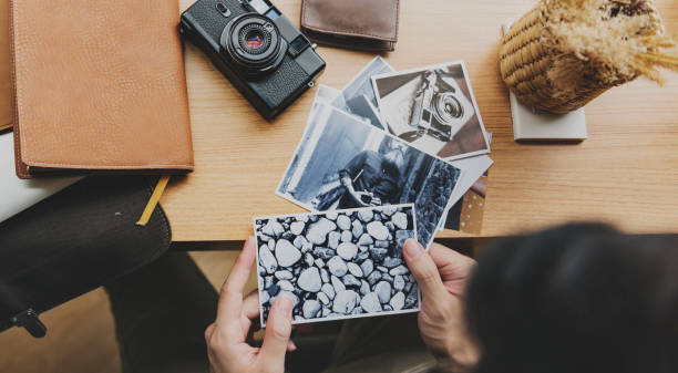 istock Young photographer selecting images photo 827846852