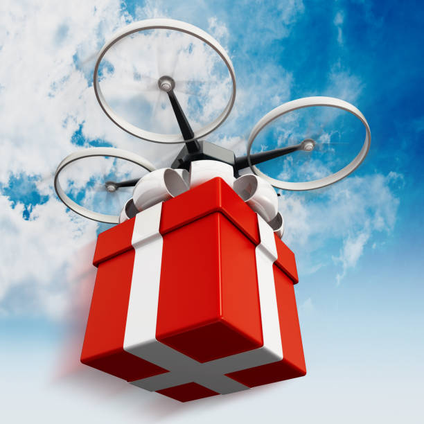 istock Drone carrying a gift box against blue cloudy sky 827847844