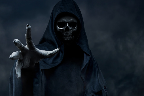 Grim Reaper on dark background