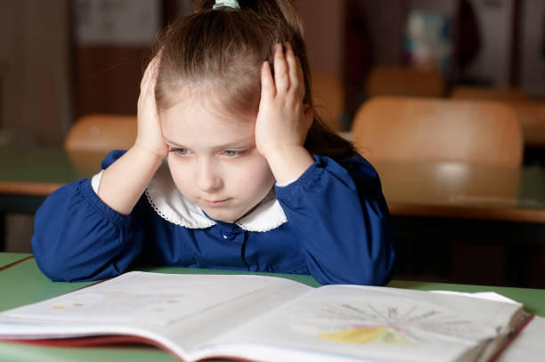 istock Tired, bored, frustrated and overwhelmed italian first-grader on 827848402