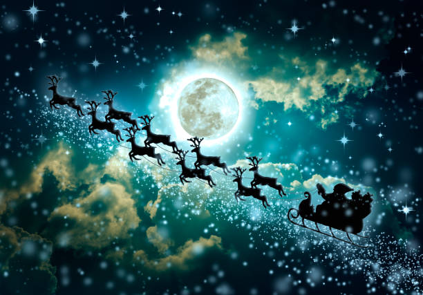 istock Silhouette of Santa Claus flying on sleigh pulled by reindeer. 827848662