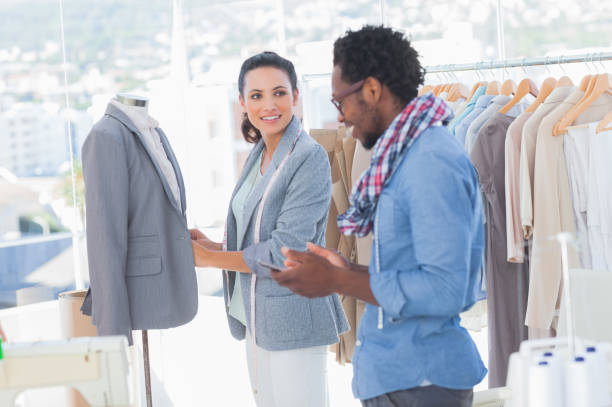 istock Fashion designers adjusting blazer 827850486