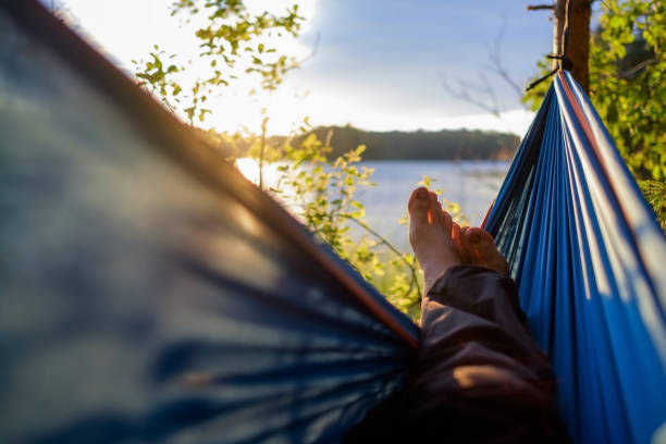 istock Man relaxing in the hammock. 827851080
